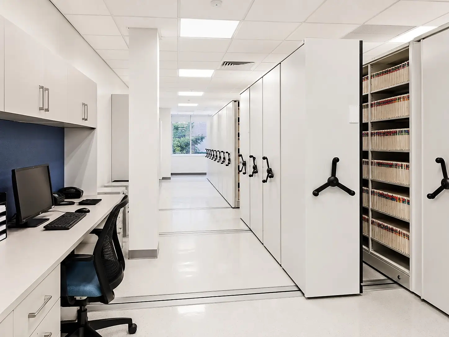 Hospital medical records storage solutions with mobile shelving in archive room